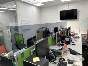 Adding glass screens to existing desk partitions