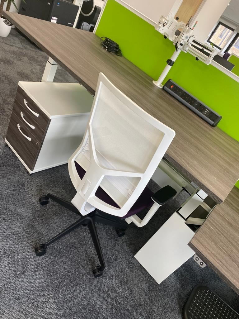 Office wood grain effect desk, built in power supply, white/purple chair, lime green screen partition