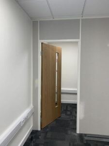 12. New first floor storage room with door hung
