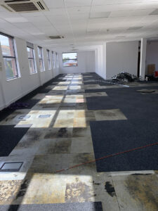 2. Removing carpet tiles to install new data