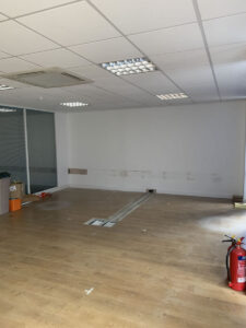 7. Ground floor office, new floorbox being cut into concrete subfloor