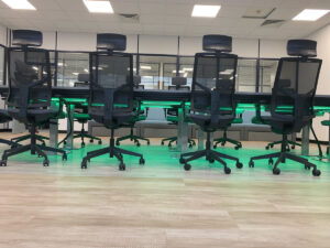 Completed boardroom table and chairs with green LED lights