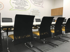Meeting room chairs, yellow with black backs