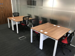 Office desking and chairs, glass wall partition