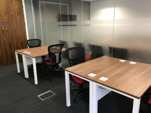 Office desking and chairs, glass wall partition
