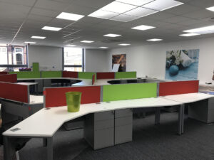 Desk screens in corporate colours