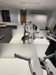 Office desks with screen support arms