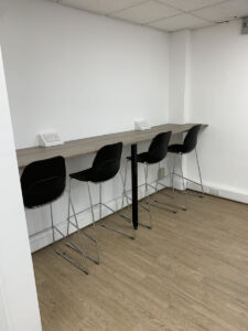 Office breakout space, breakfast bar, power sockets and seating