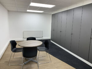 Office breakout space, flooring, lighting, storage wall and furniture