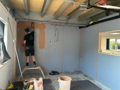 Plastering works in progress on the first floor during office renovation