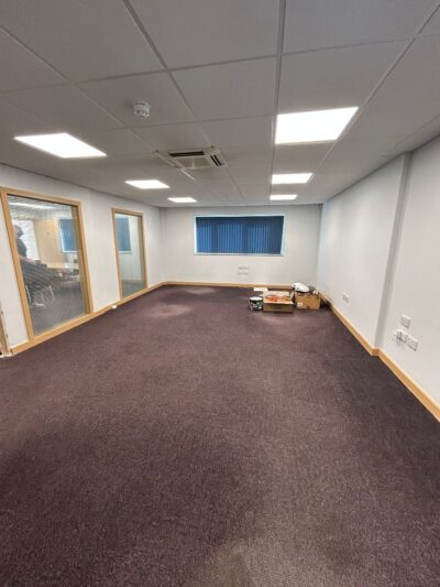 Carpet laying in newly refurbished workspace at Crane Court