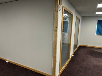Plastering works in progress on the first floor during office renovation